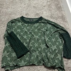 Cute dark green sweater very comfy and loose but has one little rip.